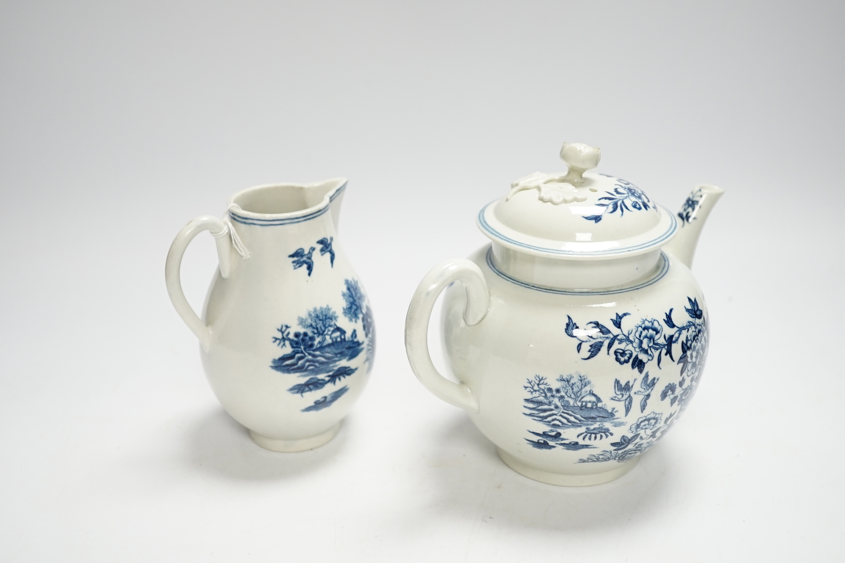 A Worcester fence pattern teapot and cover and a similar milk jug c.1775, largest 19cm wide
